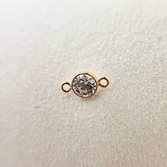 Solid gold cubic zirconia connector charm, modern sparkle in a timeless setting.