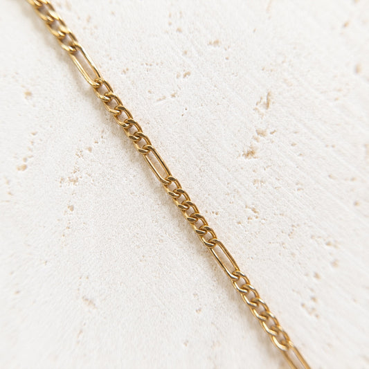 Gold figaro permanent jewellery chain