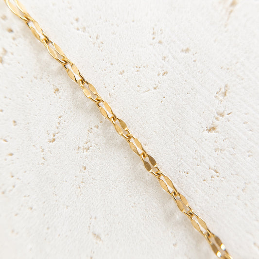 the solstice chain with faceted links made from luxury stainless steel with 14k pvd finish for permanent jewelry